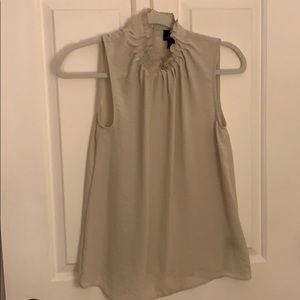 Ruffle neck sleeveless blouse